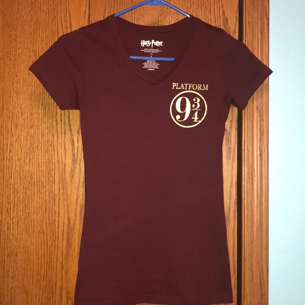 Maroon colored Harry Potter shirt.